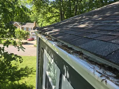 5-inch gutters with leaf guards - Need: 400x300px image of 5-inch gutters with protective leaf guard system