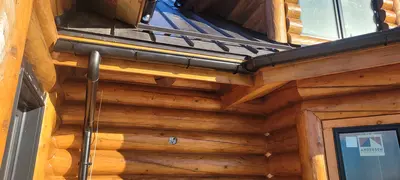 5-inch gutters on ranch home - Need: 400x300px image of 5-inch gutters installed on single-story ranch style home