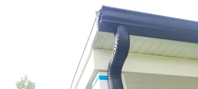 6-inch gutters on large home - Need: 400x300px image of 6-inch gutters on spacious two-story residential property