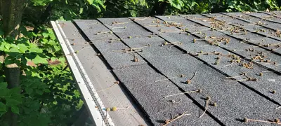 6-inch gutters during rainfall - Need: 400x300px image of 6-inch gutters effectively handling heavy rainfall